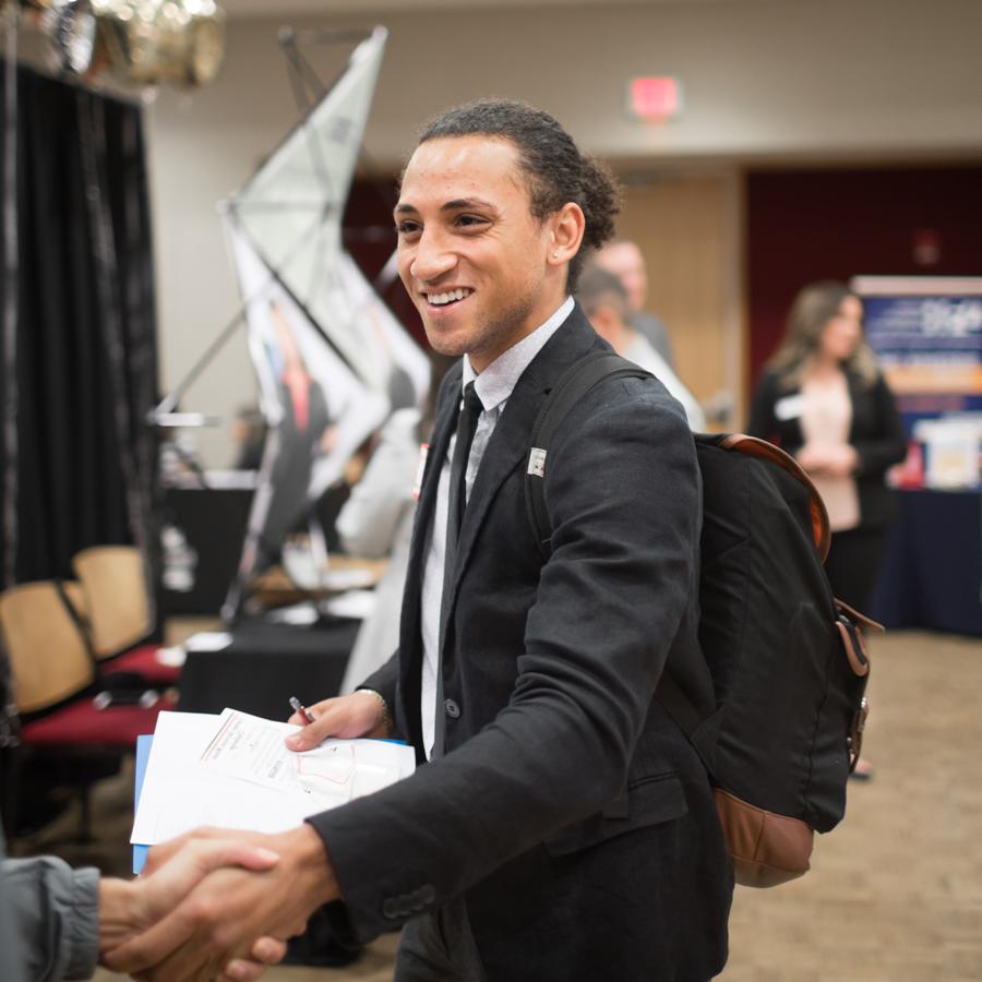 Student talking with employer at Career Fair